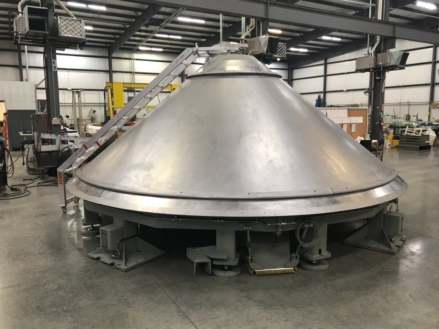 Large manufactured aerospace structure inside a D-J Engineering facility