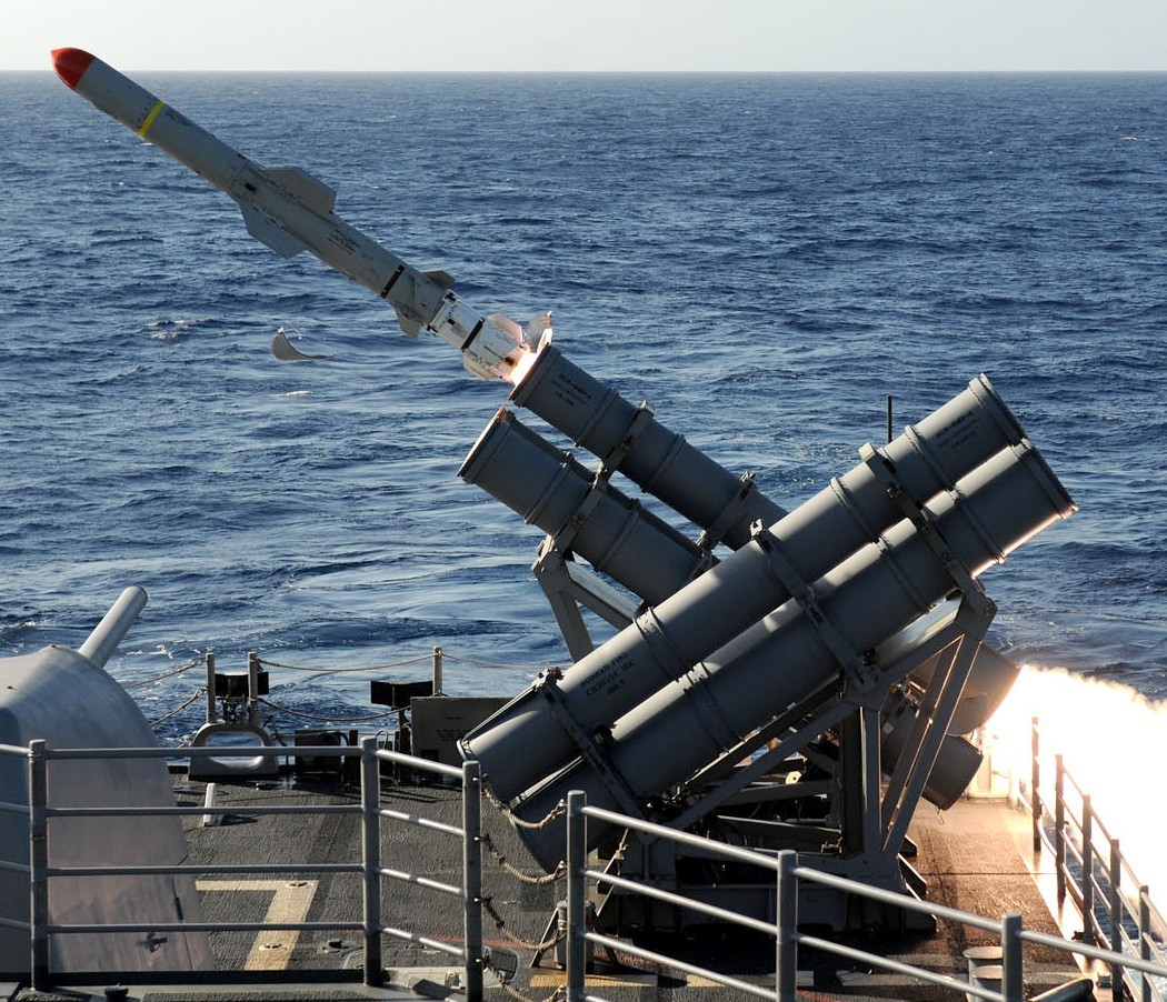 Missile launching from naval vessel.